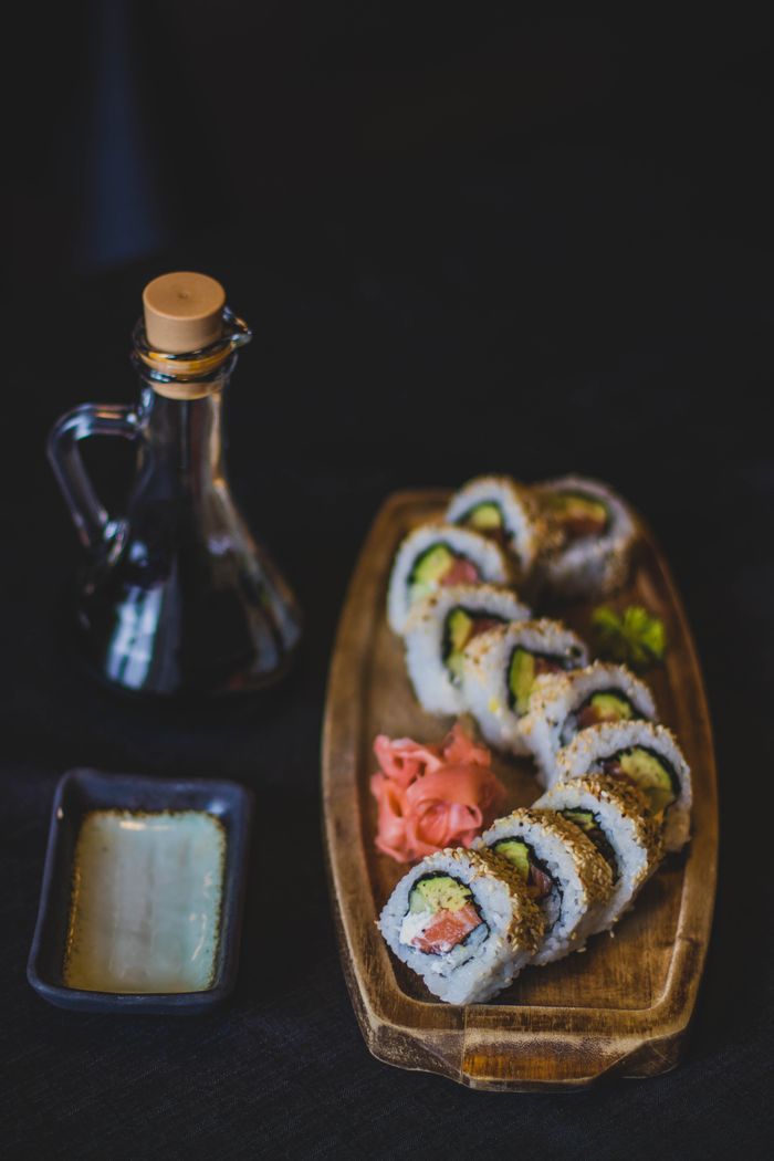 A mouthwatering sushi platter with soy sauce, perfect for a traditional Japanese meal.